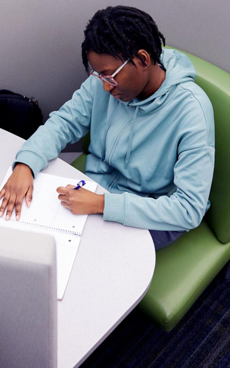 Photo of a student in the library